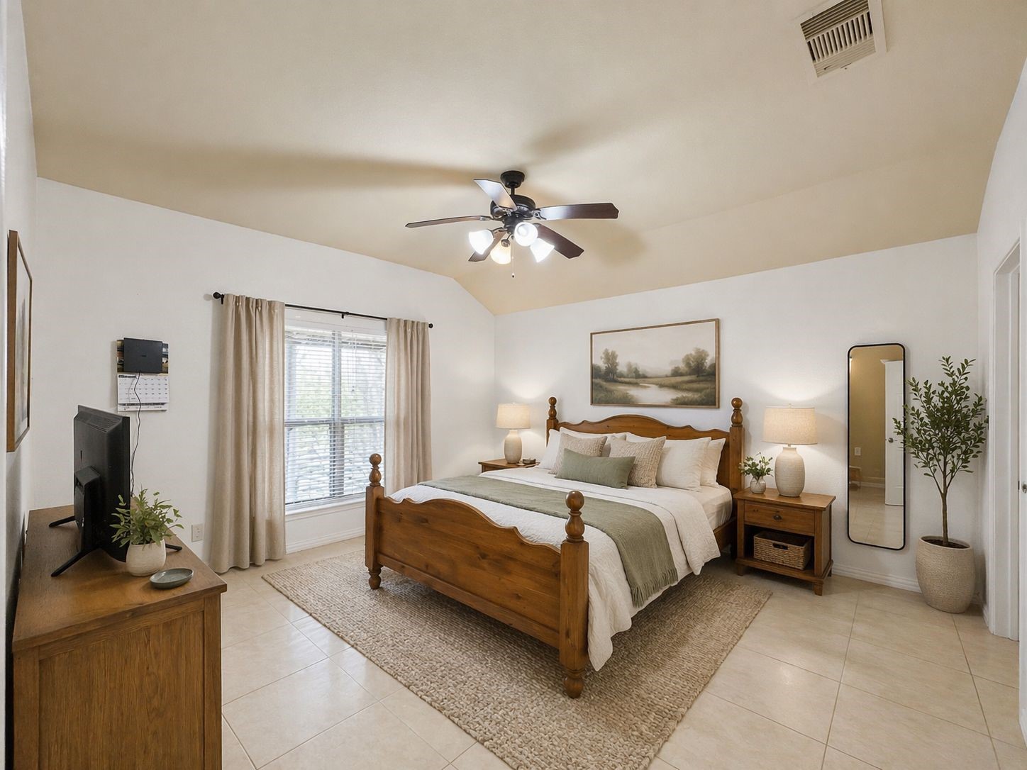 6614 Pine Tree Springs Houston, TX 77049 - Photo 6 of 14 a bedroom with a bed and a chandelier