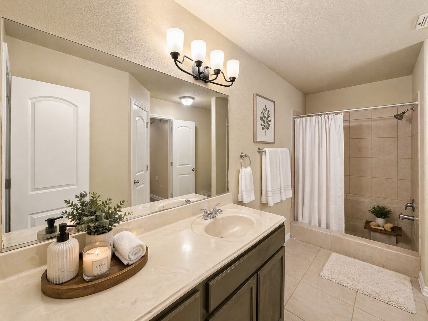 6614 Pine Tree Springs Houston, TX 77049 - Photo 7 of 14 a bathroom with a sink a mirror and a shower