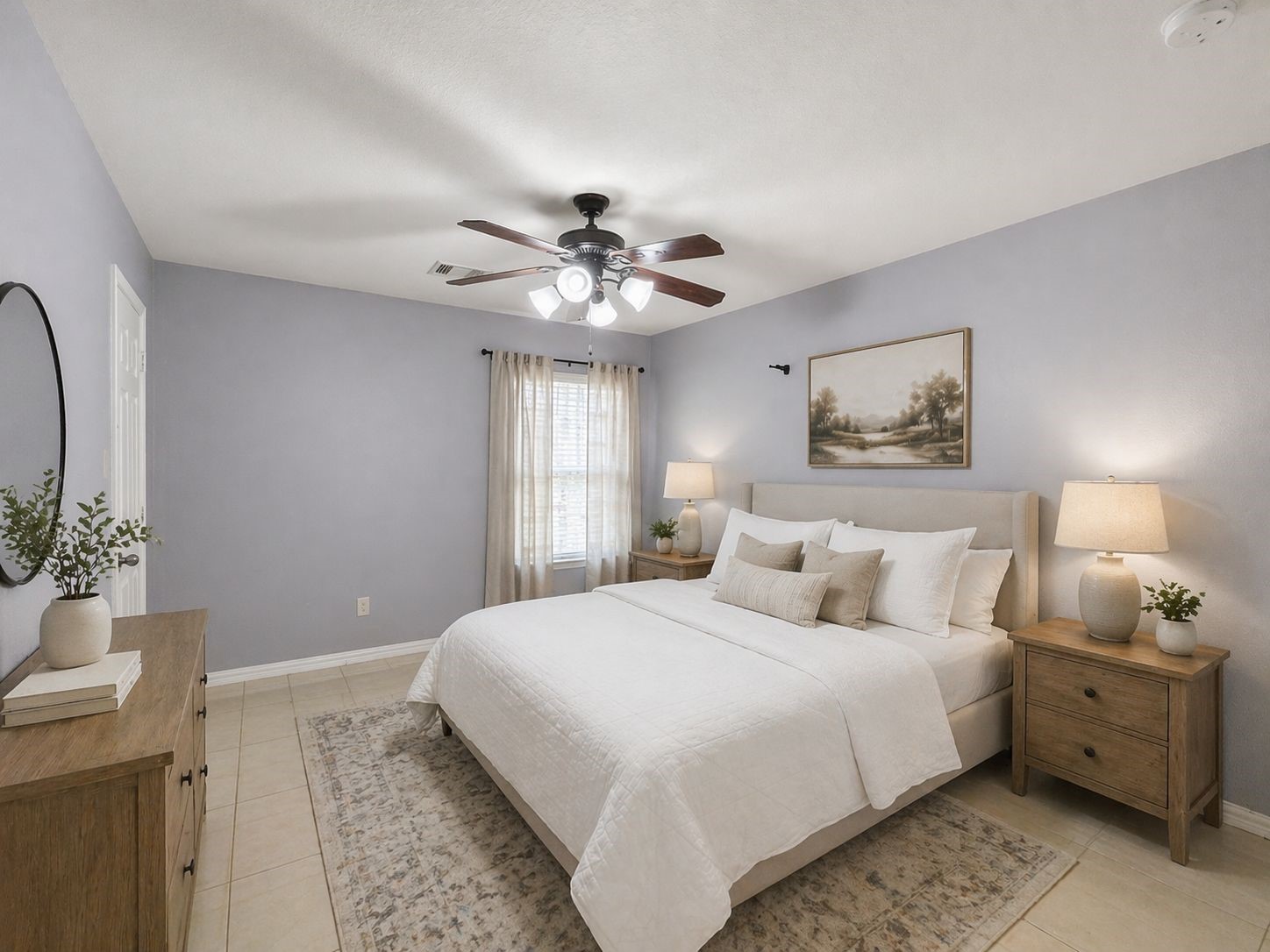 6614 Pine Tree Springs Houston, TX 77049 - Photo 8 of 14 a bedroom with a large bed and a chandelier