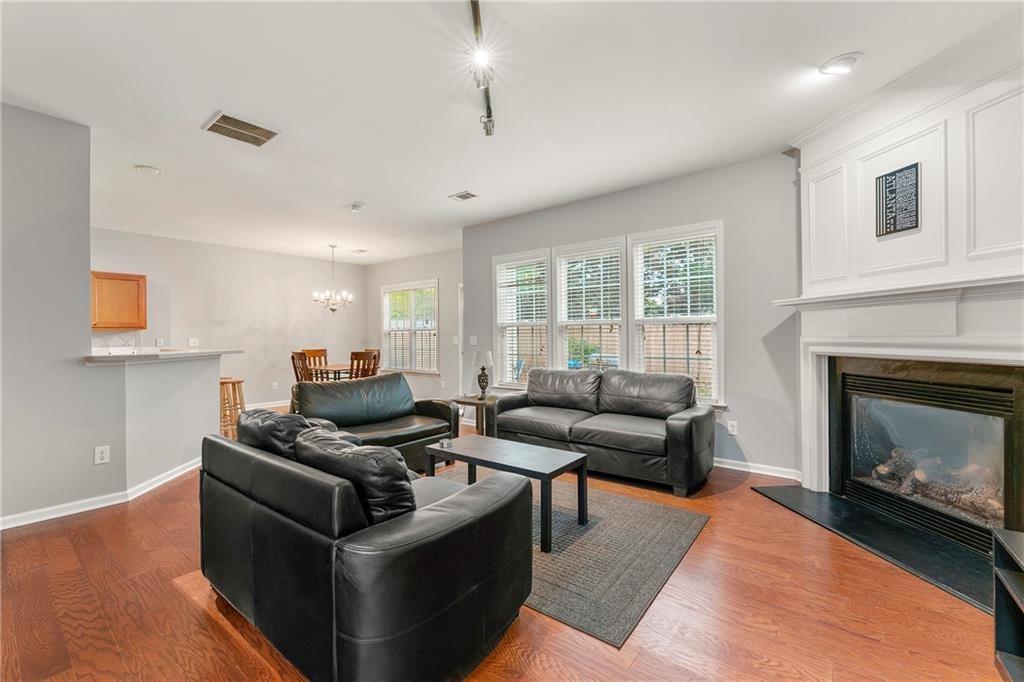 3218 Saville Street Southwest Atlanta, GA 30331 - Photo 11 of 12 a living room with furniture and a fireplace
