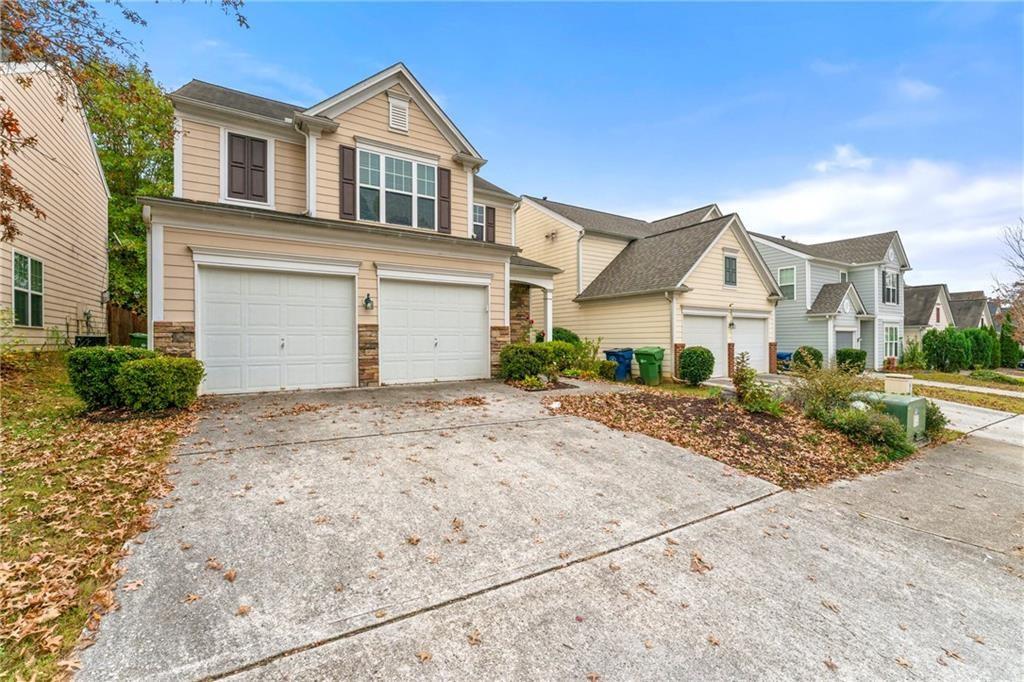 3218 Saville Street Southwest Atlanta, GA 30331 - Photo 12 of 12 a front view of a house with a yard