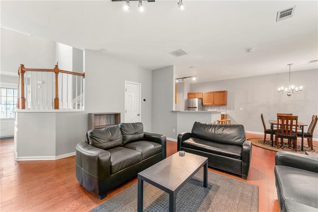 3218 Saville Street Southwest Atlanta, GA 30331 - Photo 3 of 12 a living room with furniture and wooden floor