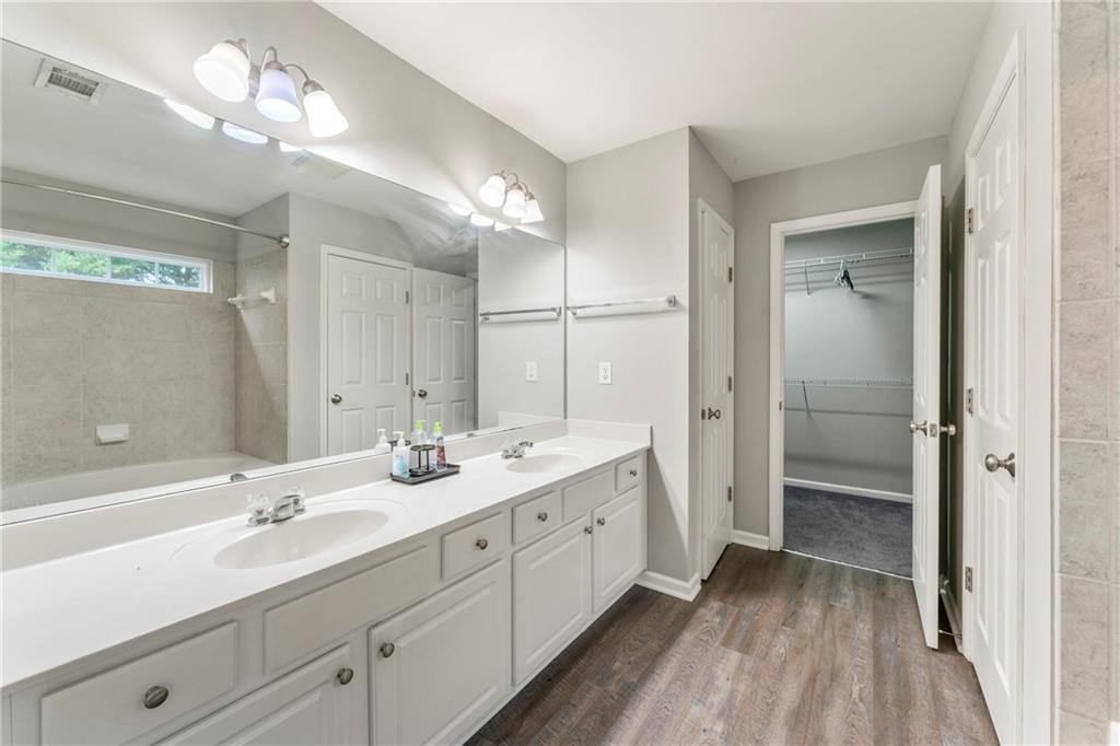 3218 Saville Street Southwest Atlanta, GA 30331 - Photo 7 of 12 a bathroom with a double vanity sink and a mirror