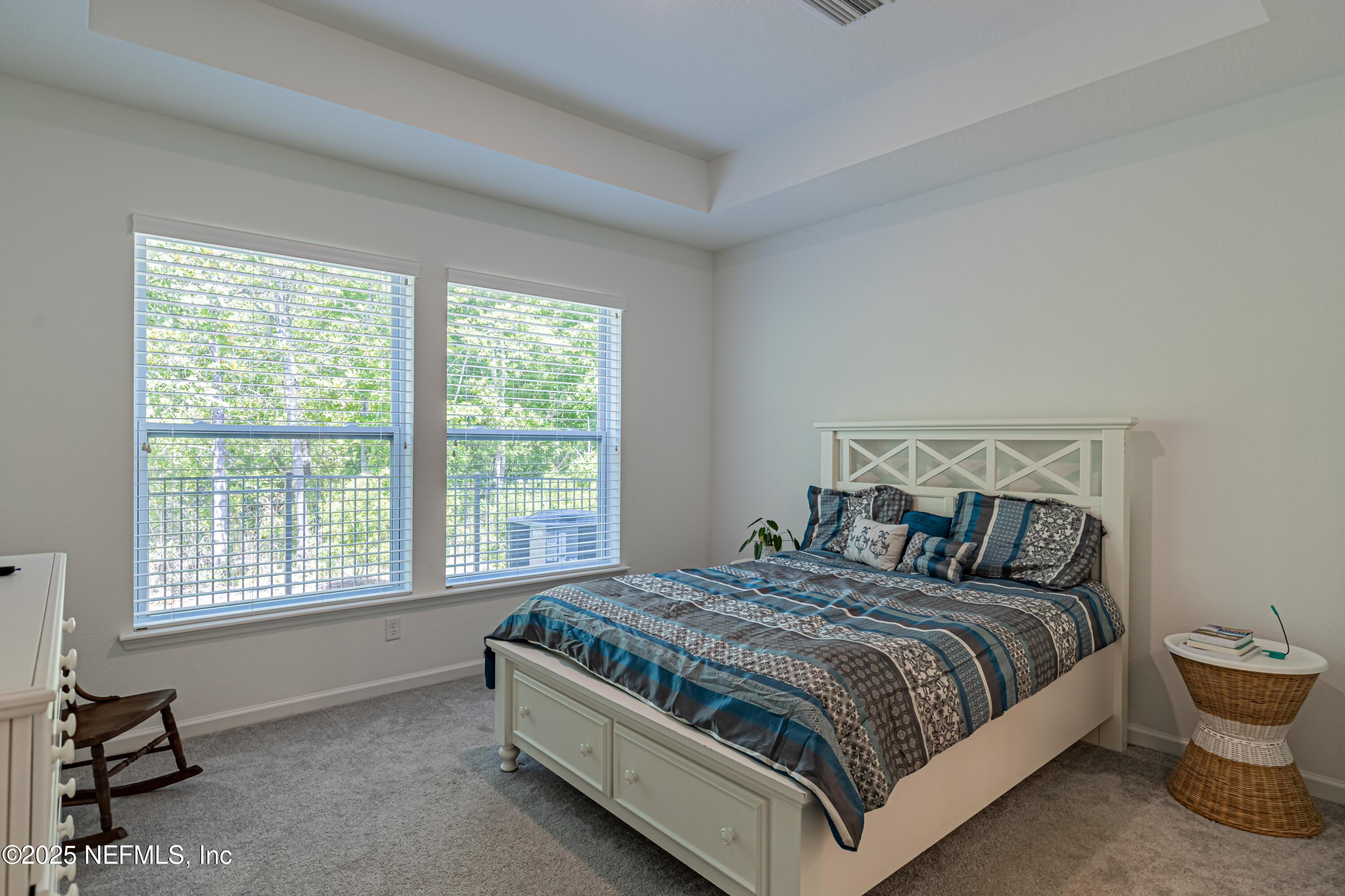 383 Windswept Way Street St. Augustine, FL 32092 - Photo 21 of 34 a bedroom with a bed and a window