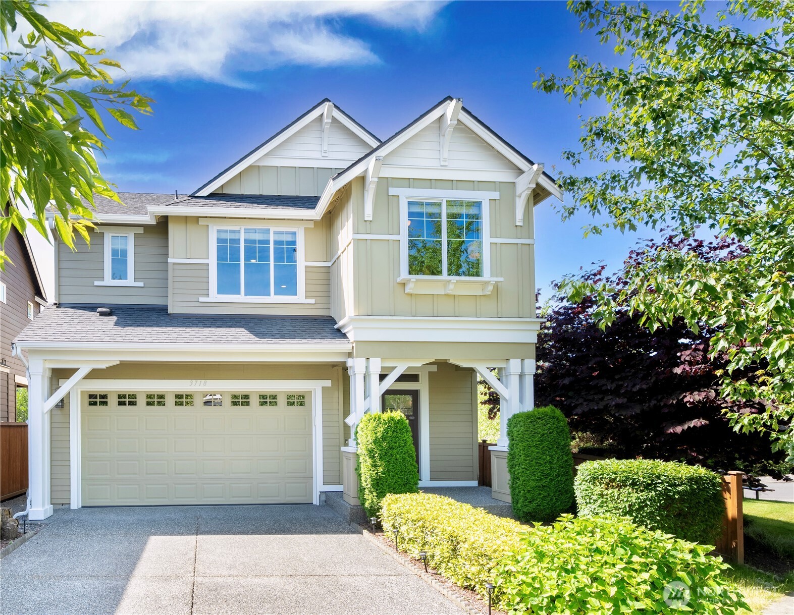 a front view of a house with a garden