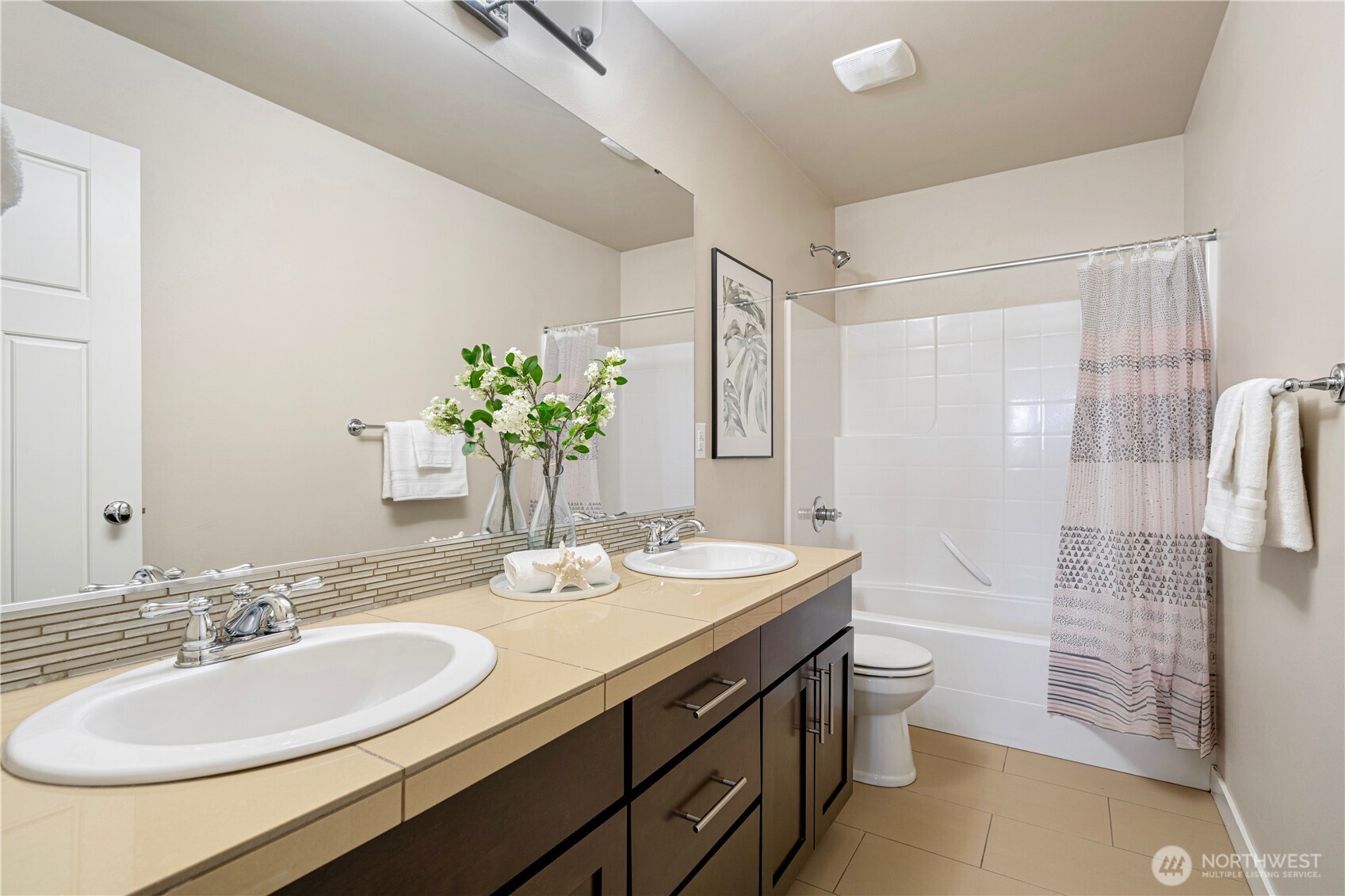 3718 226th Place Southeast Bothell, WA 98021 - Photo 19 of 30 a bathroom with a double vanity sink toilet and shower