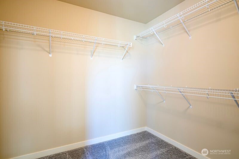 3718 226th Place Southeast Bothell, WA 98021 - Photo 22 of 30 a view of a room with racks on the wall