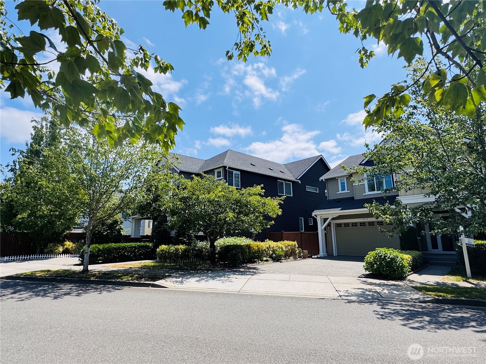3718 226th Place Southeast Bothell, WA 98021 - Photo 30 of 30 a front view of a house with a yard and a garden