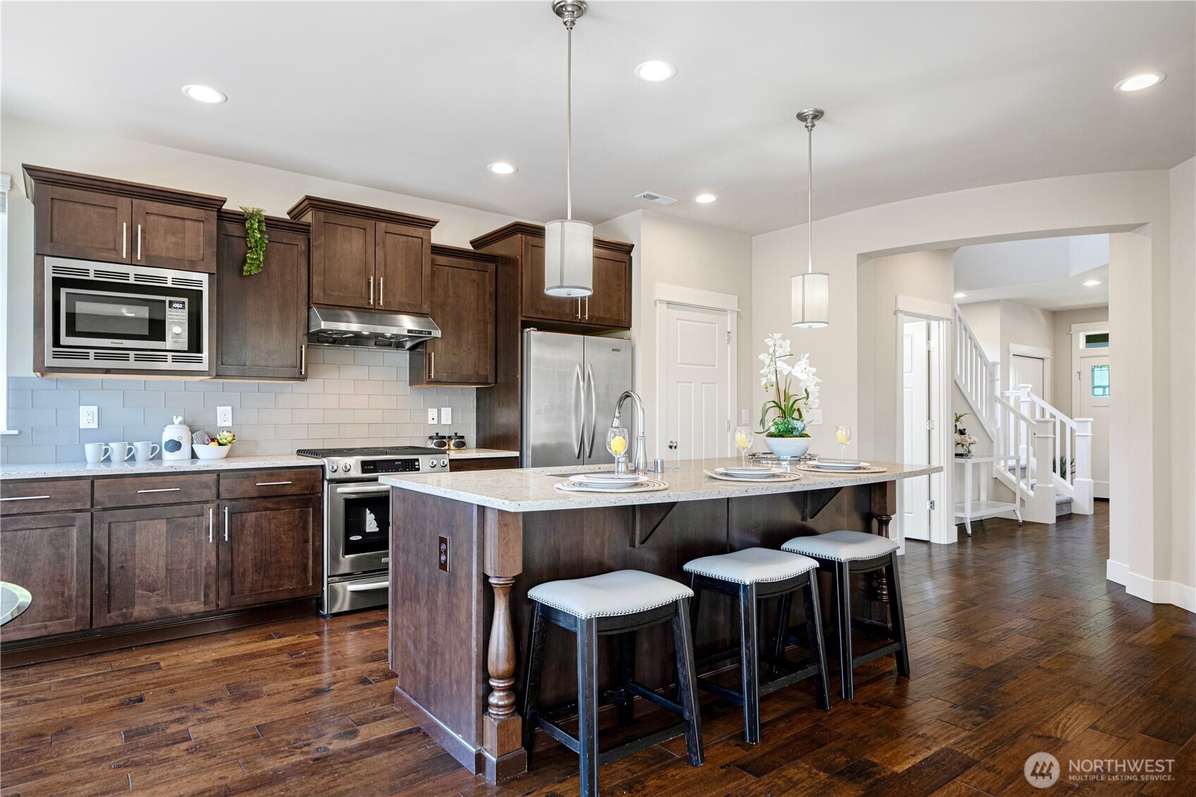 3718 226th Place Southeast Bothell, WA 98021 - Photo 6 of 30 a large kitchen with a table and chairs in it