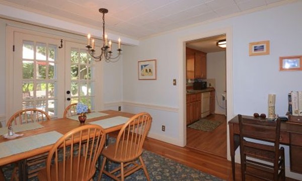 1 White Road Wayland, MA 01778 - Photo 14 of 22 a view of a dining room with furniture and wooden floor