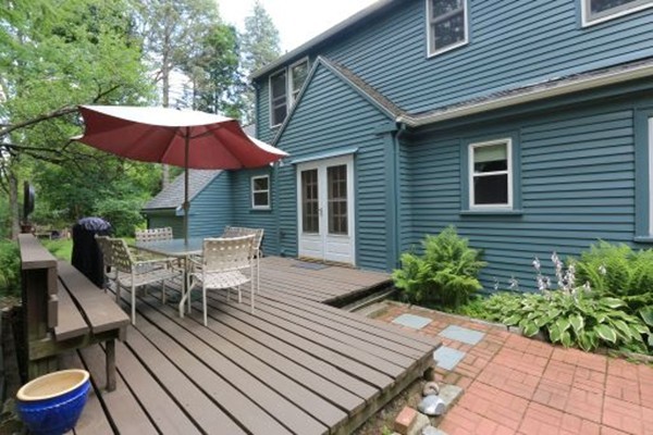 1 White Road Wayland, MA 01778 - Photo 4 of 22 a view of house with wooden deck and furniture