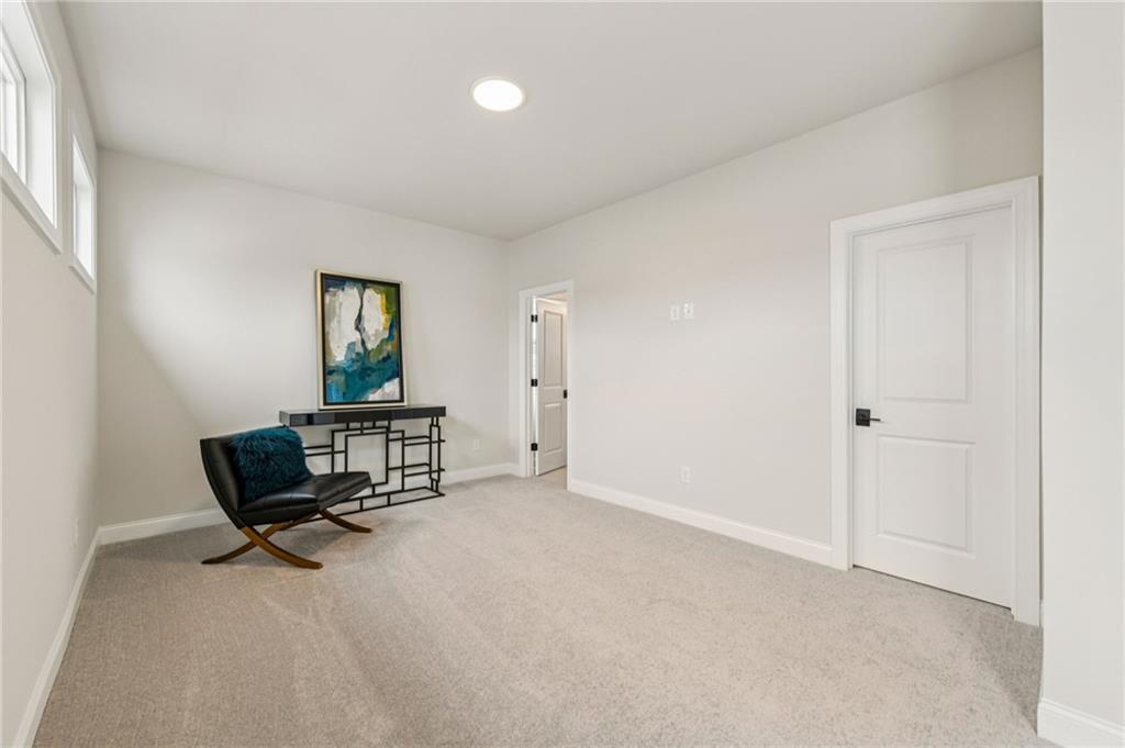 526 Pearl Street Cumming, GA 30040 - Photo 25 of 39 an empty room with windows and couch
