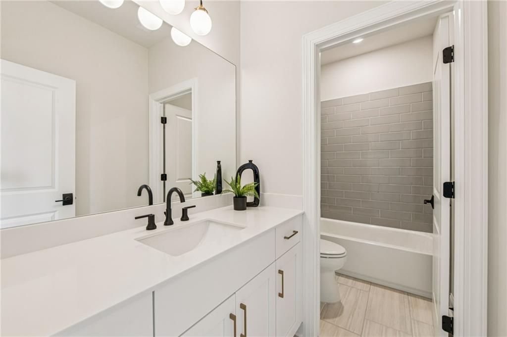 526 Pearl Street Cumming, GA 30040 - Photo 28 of 39 a bathroom with a sink and a mirror