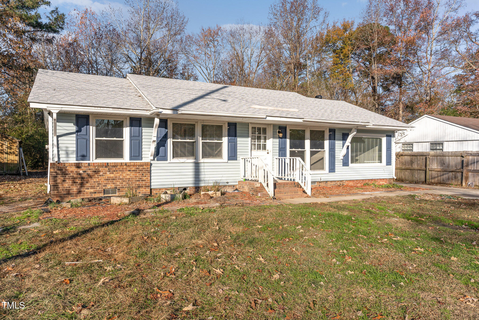 3015 Brinkley Drive Spring Lake, NC 28390 - Photo 2 of 28 a front view of a house with a yard and trees