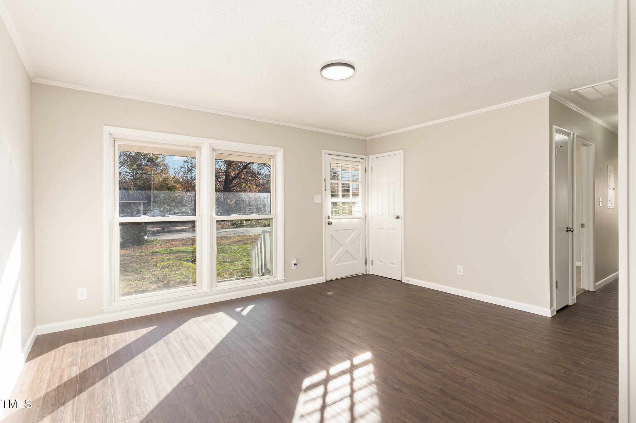 3015 Brinkley Drive Spring Lake, NC 28390 - Photo 6 of 28 an empty room with wooden floor and windows
