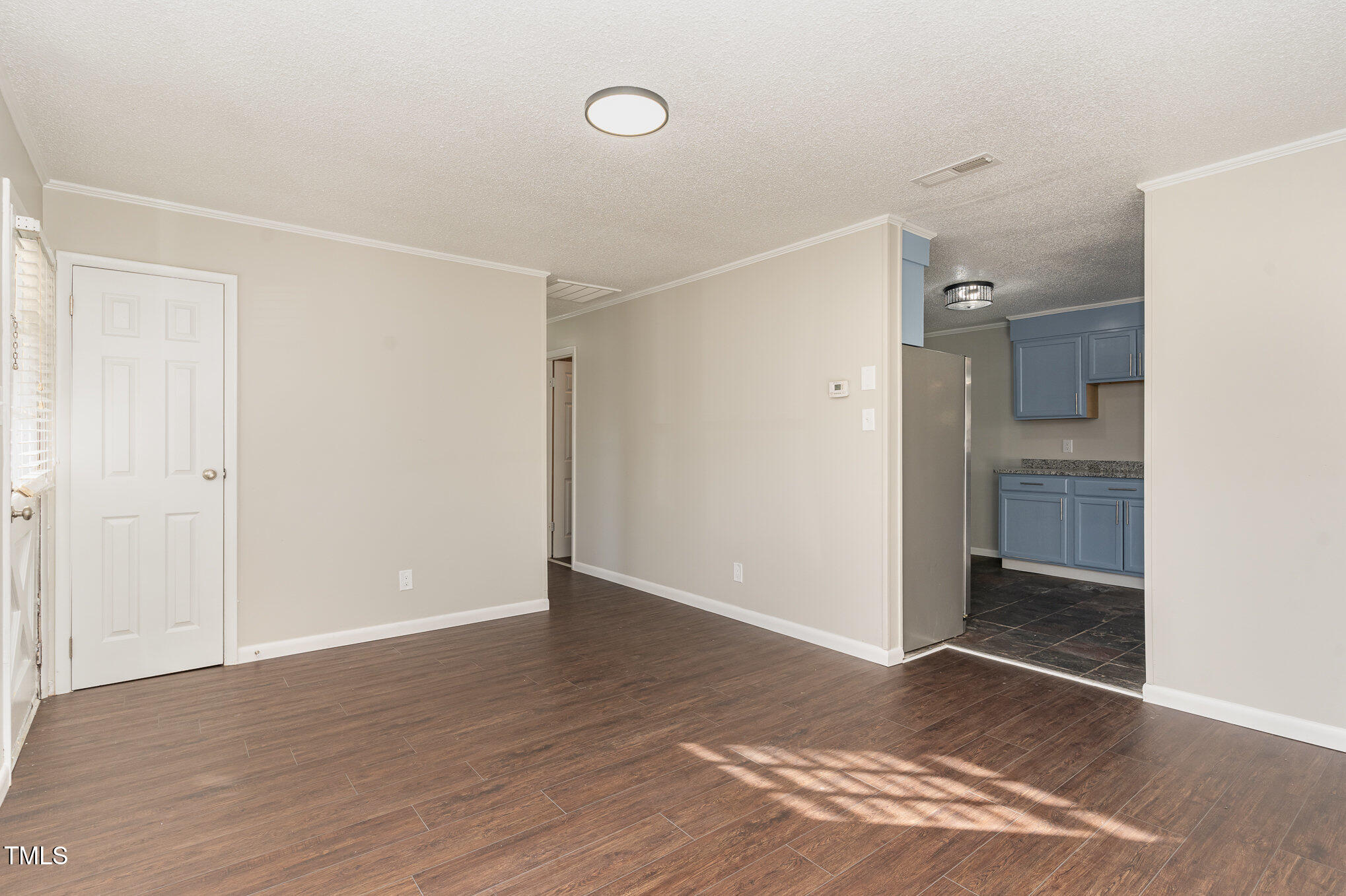 3015 Brinkley Drive Spring Lake, NC 28390 - Photo 7 of 28 a view of an empty room with wooden floor and a bathroom