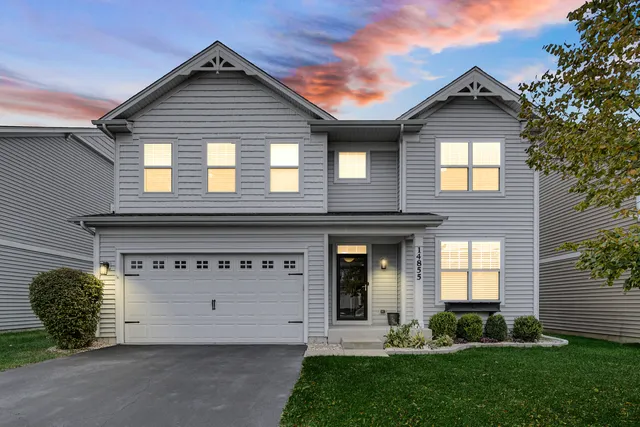 front view of a house with a yard