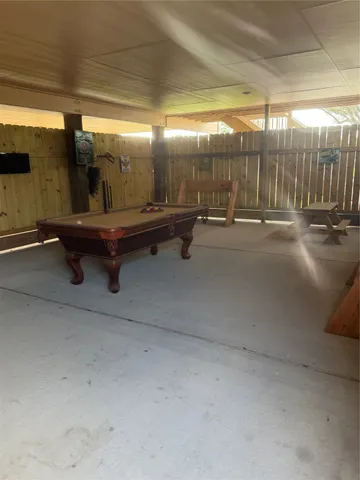 a view of a swimming pool with an outdoor seating