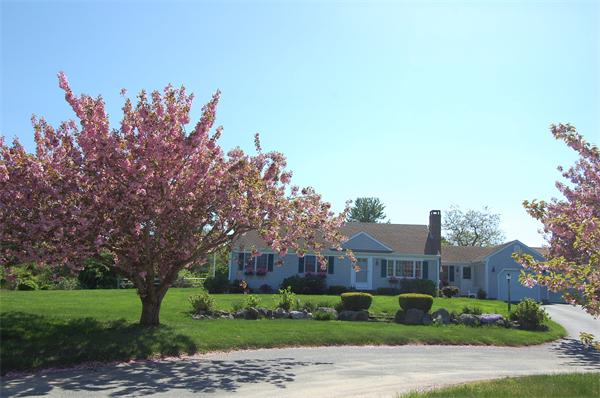 39 Fox Ridge Drive Orleans, MA 02653 - Photo 1 of 1 a front view of a house with a yard and trees