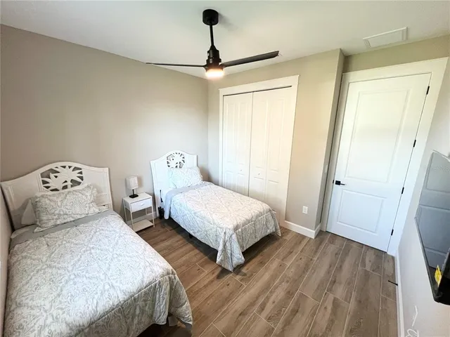 a bedroom with bed and a window