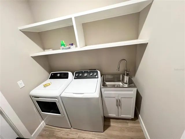 a view of a house with pool and garden