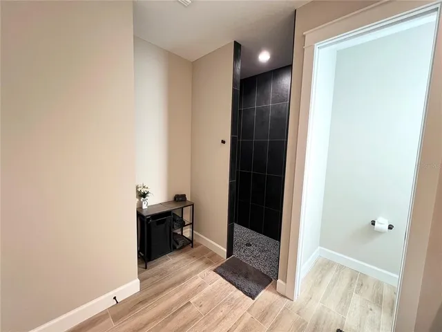 a bathroom with double vanity and a mirror