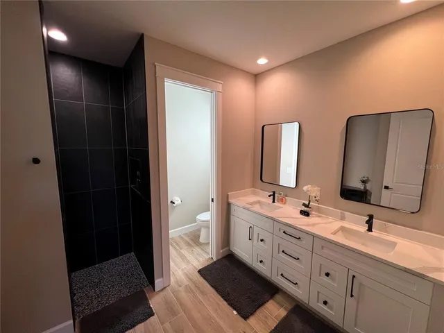 a bedroom with two beds and a window