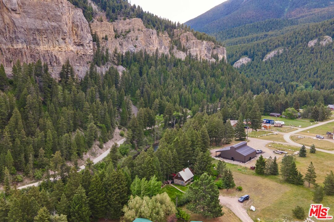64050 Gallatin Road Gallatin Gateway, MT 59730 - Photo 28 of 55 a view of a lot of trees and cars