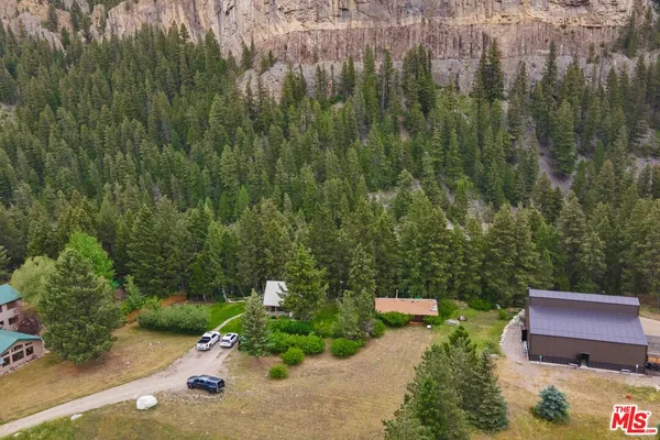 a view of a house with a mountain in the background
