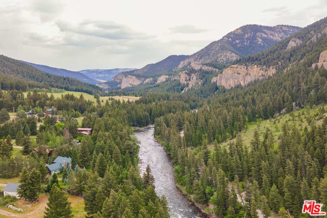 64050 Gallatin Road Gallatin Gateway, MT 59730 - Photo 31 of 55 a view of a house with a mountain in the background