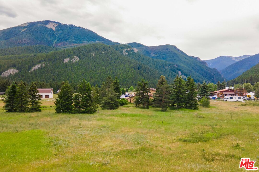 64050 Gallatin Road Gallatin Gateway, MT 59730 - Photo 36 of 55 a view of a lush green hillside and houses