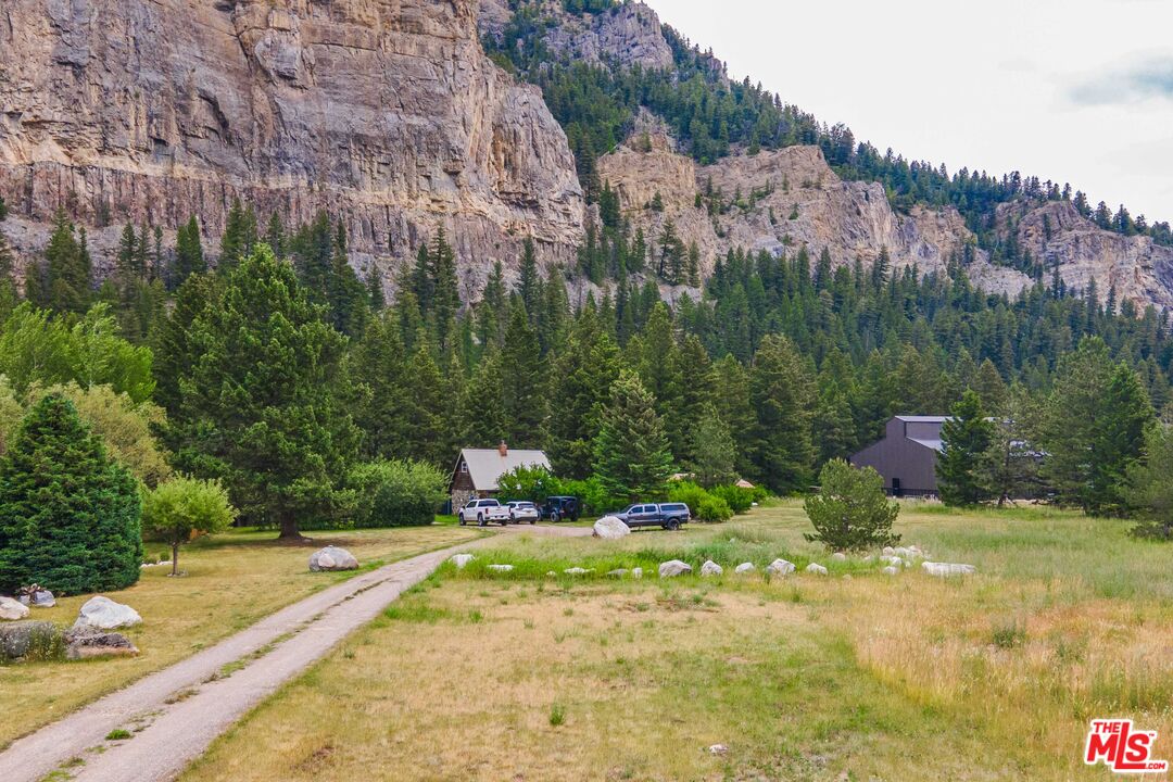 64050 Gallatin Road Gallatin Gateway, MT 59730 - Photo 37 of 55 a view of a backyard with a fountain