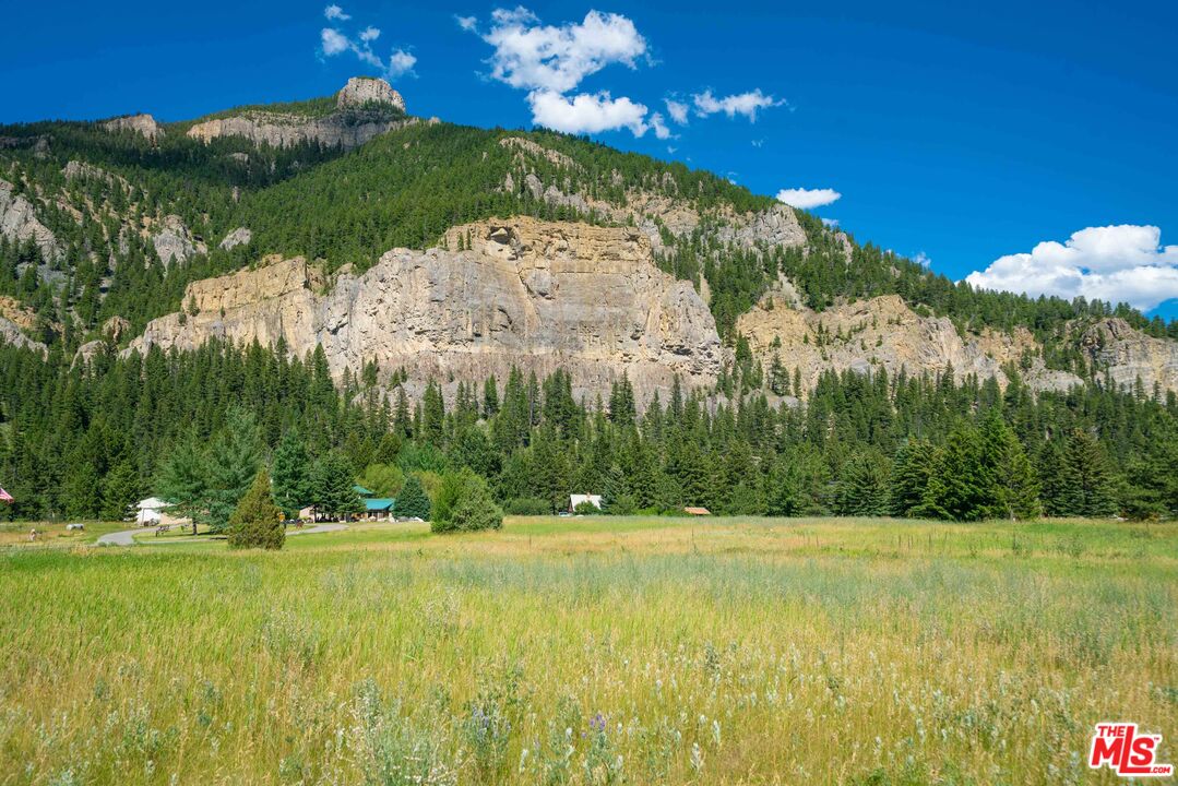 64050 Gallatin Road Gallatin Gateway, MT 59730 - Photo 50 of 55 a view of a house with a big yard