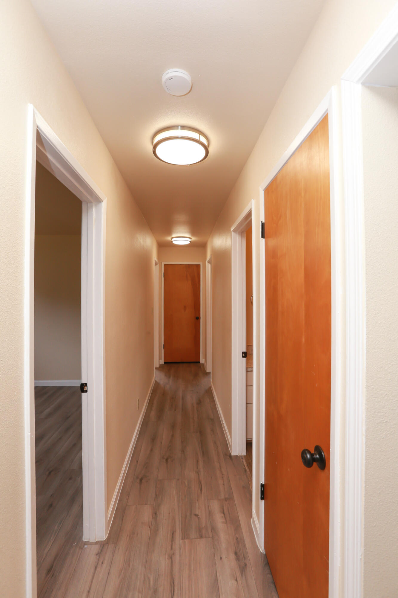 5572 Olive Street Anderson, CA 96007 - Photo 13 of 31 a view of a hallway with wooden floor