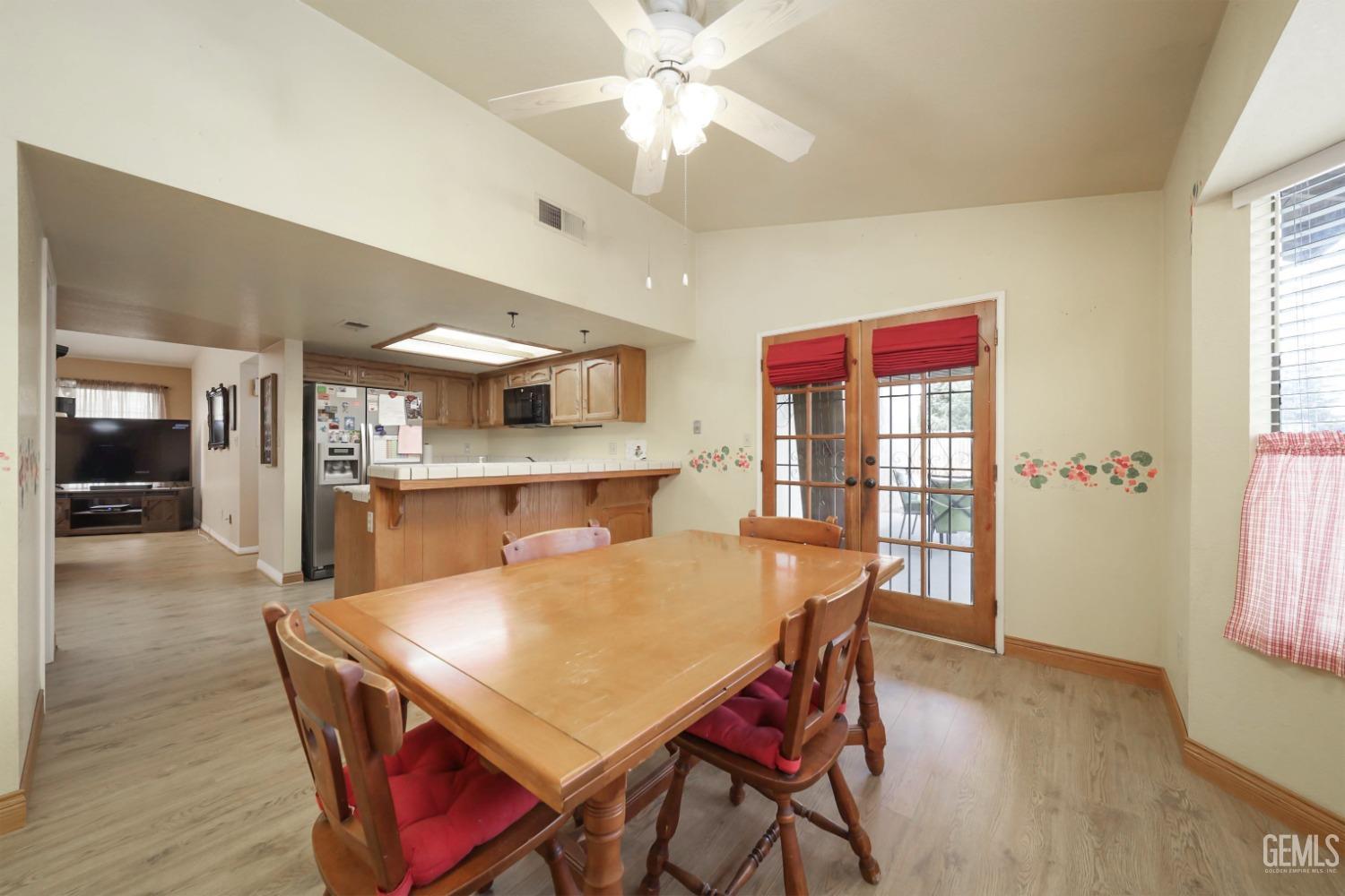 Undisclosed Address Bakersfield, CA 93314 - Photo 14 of 29 a view of a dining room with furniture window and wooden floor