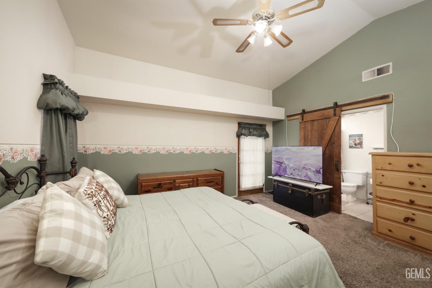 Undisclosed Address Bakersfield, CA 93314 - Photo 18 of 29 a bedroom with a bed and wooden floor