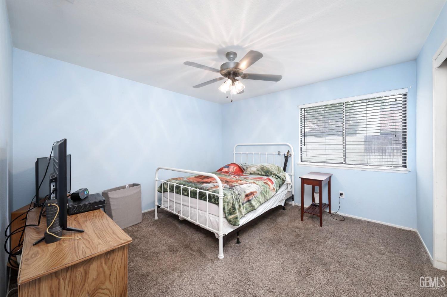Undisclosed Address Bakersfield, CA 93314 - Photo 20 of 29 a bedroom with a bed and a window