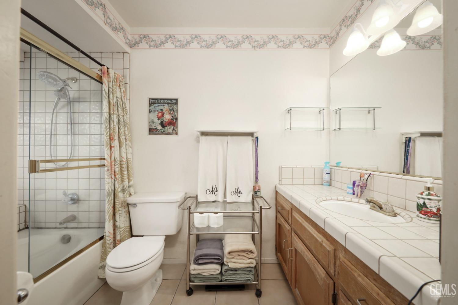 Undisclosed Address Bakersfield, CA 93314 - Photo 21 of 29 a bathroom with a sink mirror toilet and shower