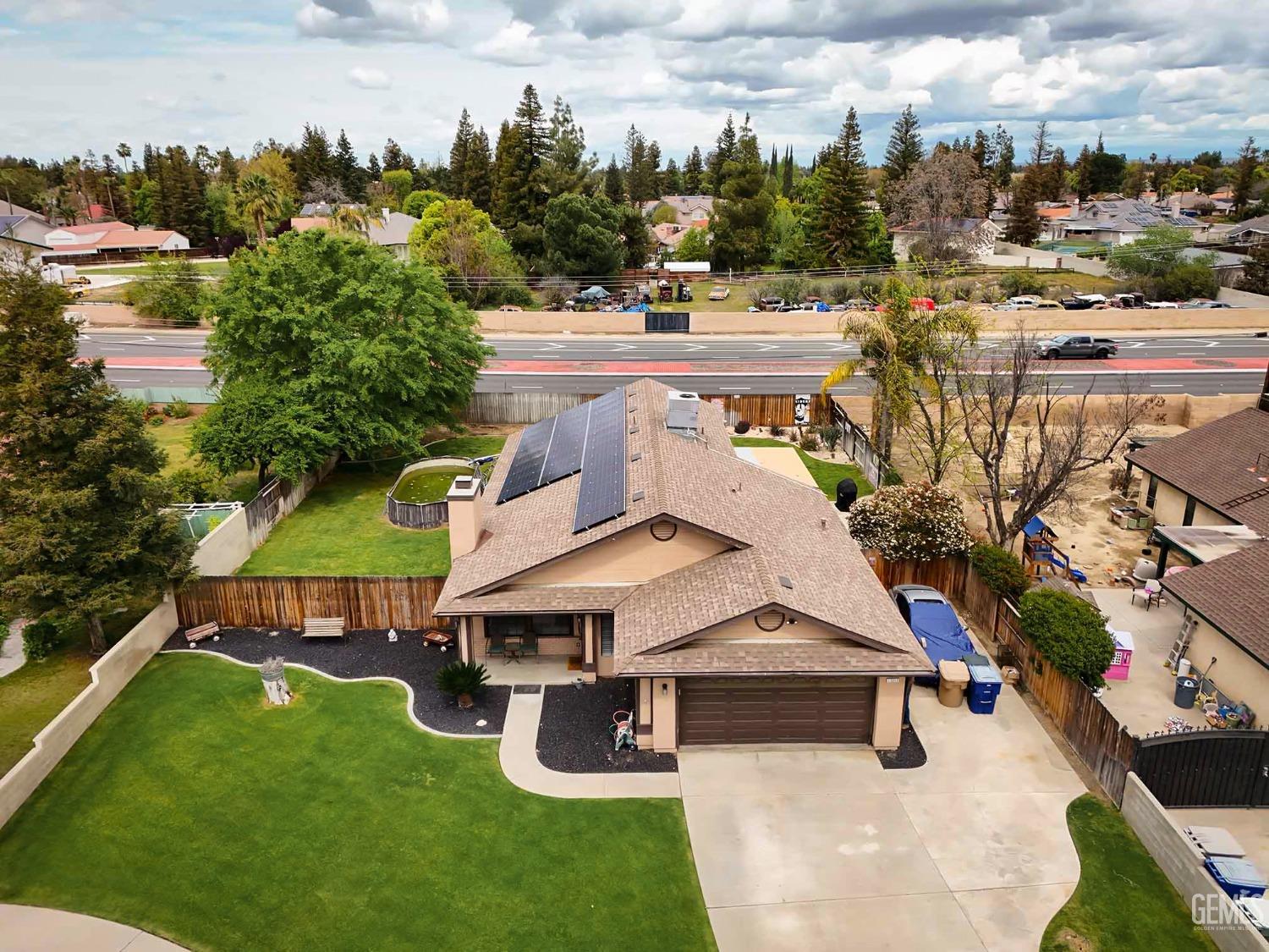 Undisclosed Address Bakersfield, CA 93314 - Photo 27 of 29 an aerial view of a house with swimming pool garden and outdoor seating