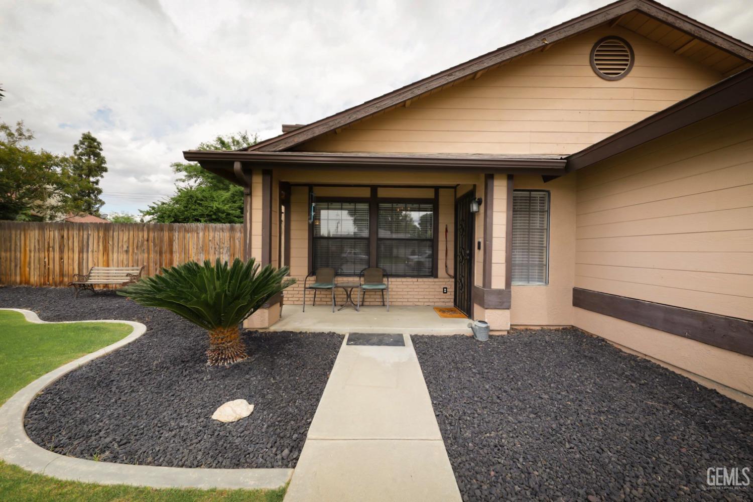 Undisclosed Address Bakersfield, CA 93314 - Photo 5 of 29 a view of a house with backyard porch and sitting area