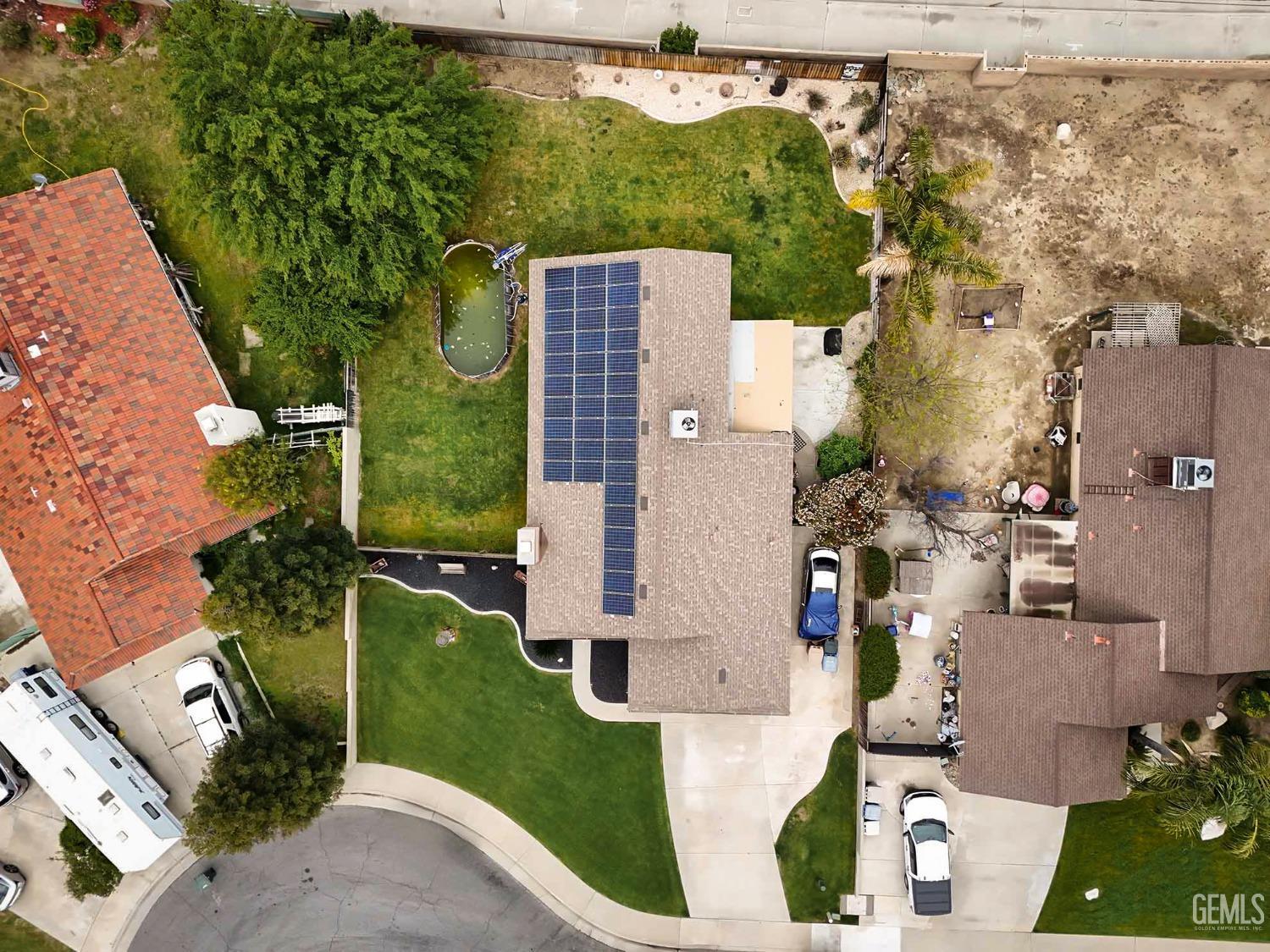 Undisclosed Address Bakersfield, CA 93314 - Photo 7 of 29 an aerial view of a house with a yard
