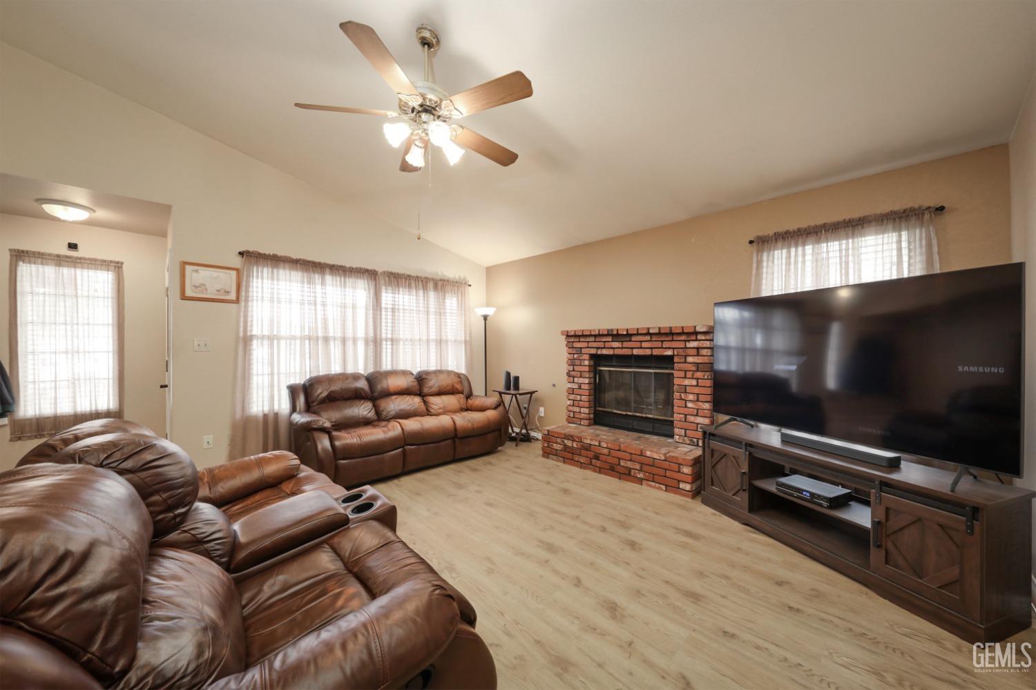 Undisclosed Address Bakersfield, CA 93314 - Photo 10 of 29 a living room with furniture and a flat screen tv