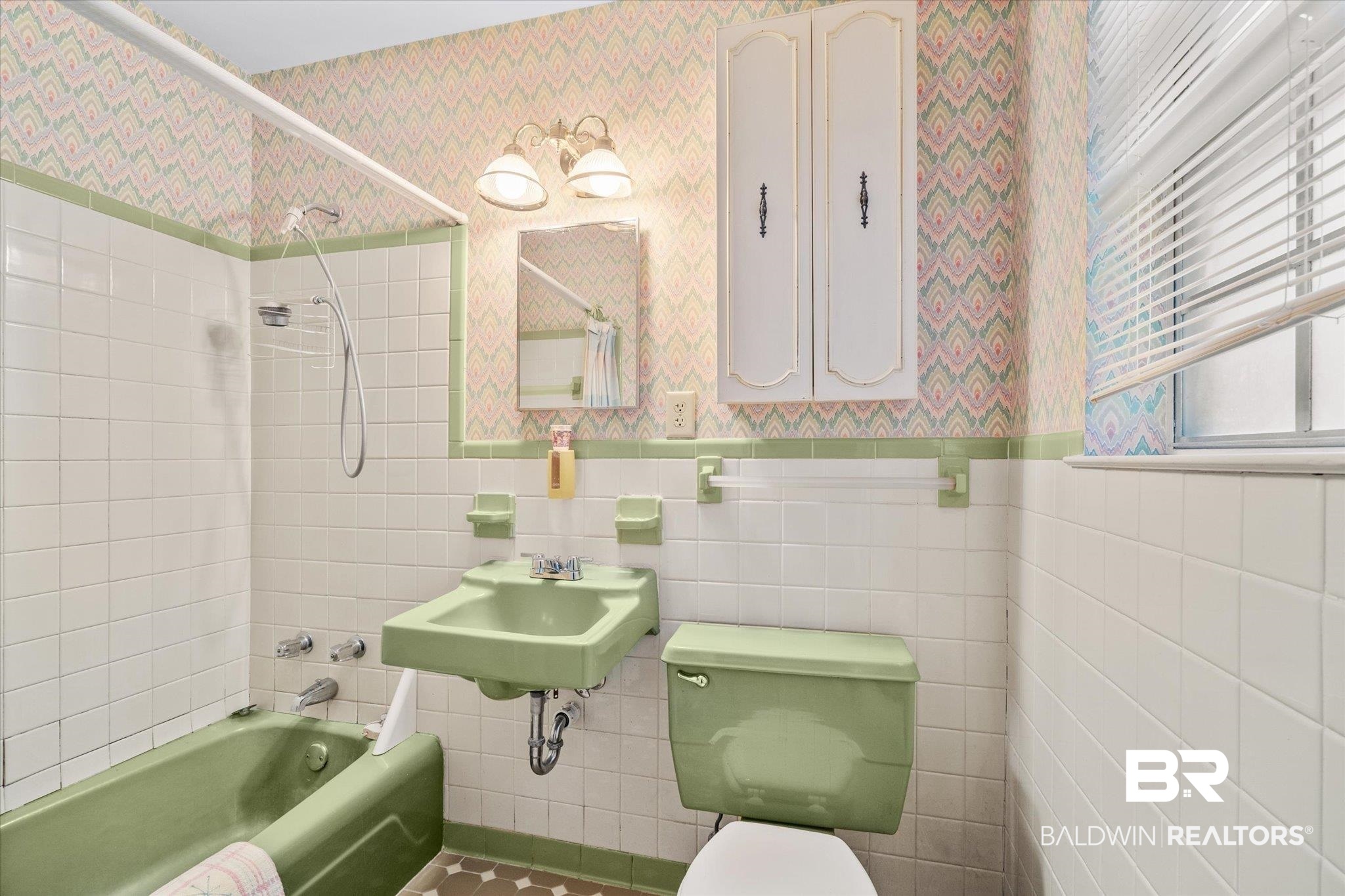 5608 Judson Circle Mobile, AL 36608 - Photo 11 of 20 Full bathroom featuring tile walls, toilet, tiled shower / bath combo, and sink