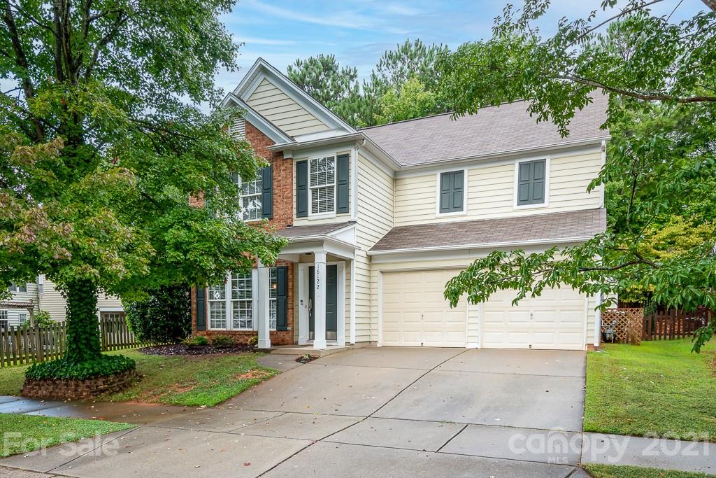 18122 Bluff Inlet Road Cornelius, NC 28031 - Photo 2 of 34 a house that has a tree in front of the house