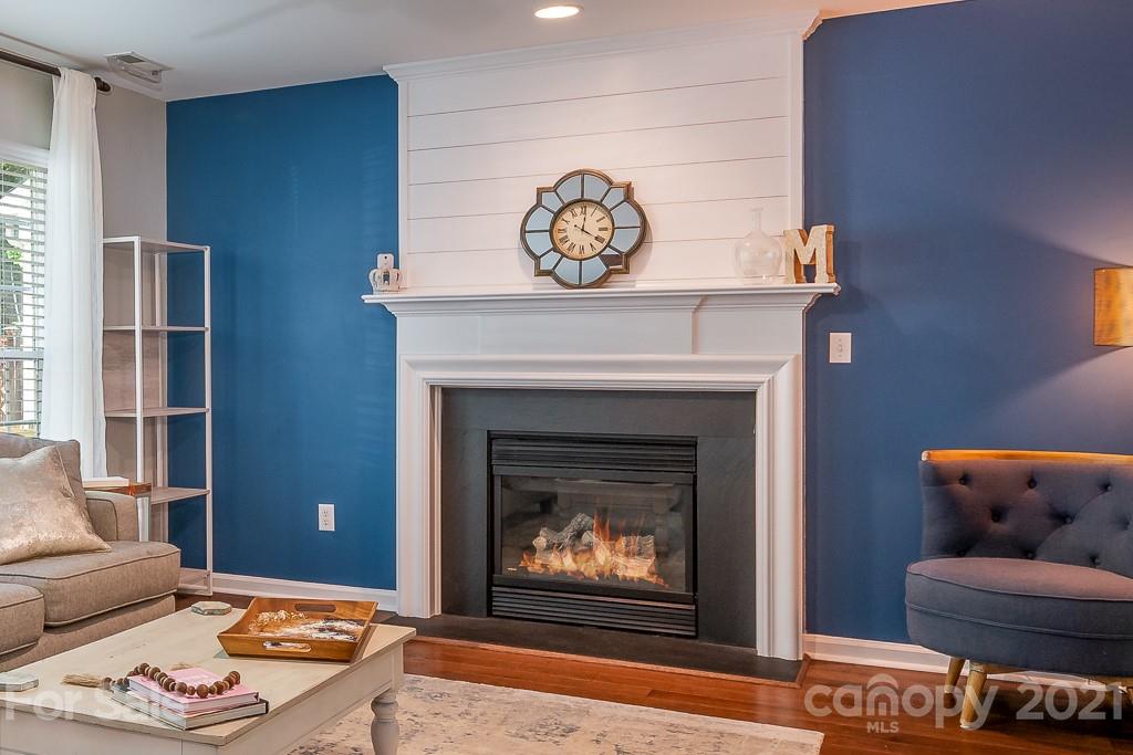 18122 Bluff Inlet Road Cornelius, NC 28031 - Photo 15 of 34 a living room with furniture and a fireplace