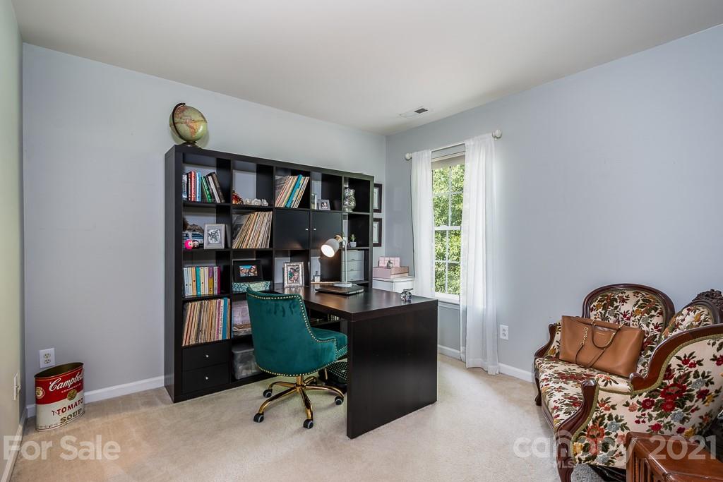 18122 Bluff Inlet Road Cornelius, NC 28031 - Photo 25 of 34 a view of a workspace with a window and shelf