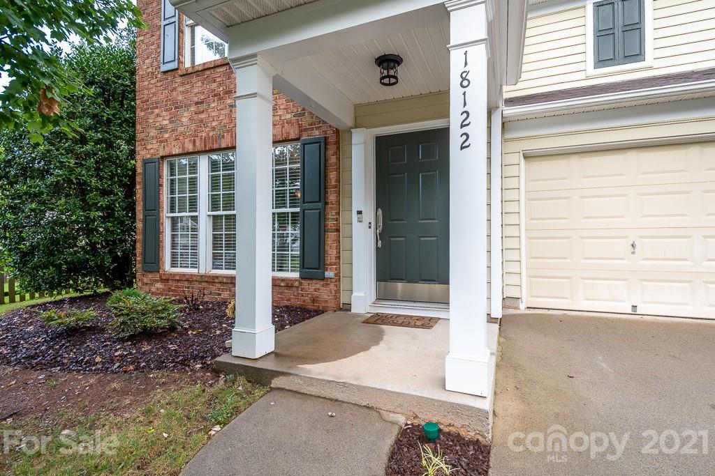 18122 Bluff Inlet Road Cornelius, NC 28031 - Photo 5 of 34 a front view of a house with a yard