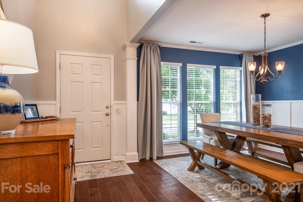 18122 Bluff Inlet Road Cornelius, NC 28031 - Photo 6 of 34 a very nice looking room with a large window and chandelier