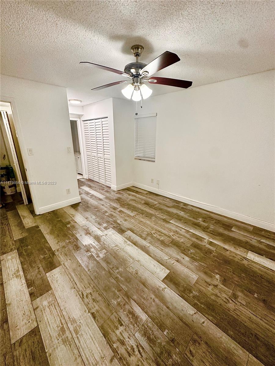 530 South Park Road, Unit 1711 Hollywood, FL 33021 - Photo 13 of 25 a view of a livingroom with a ceiling fan and window