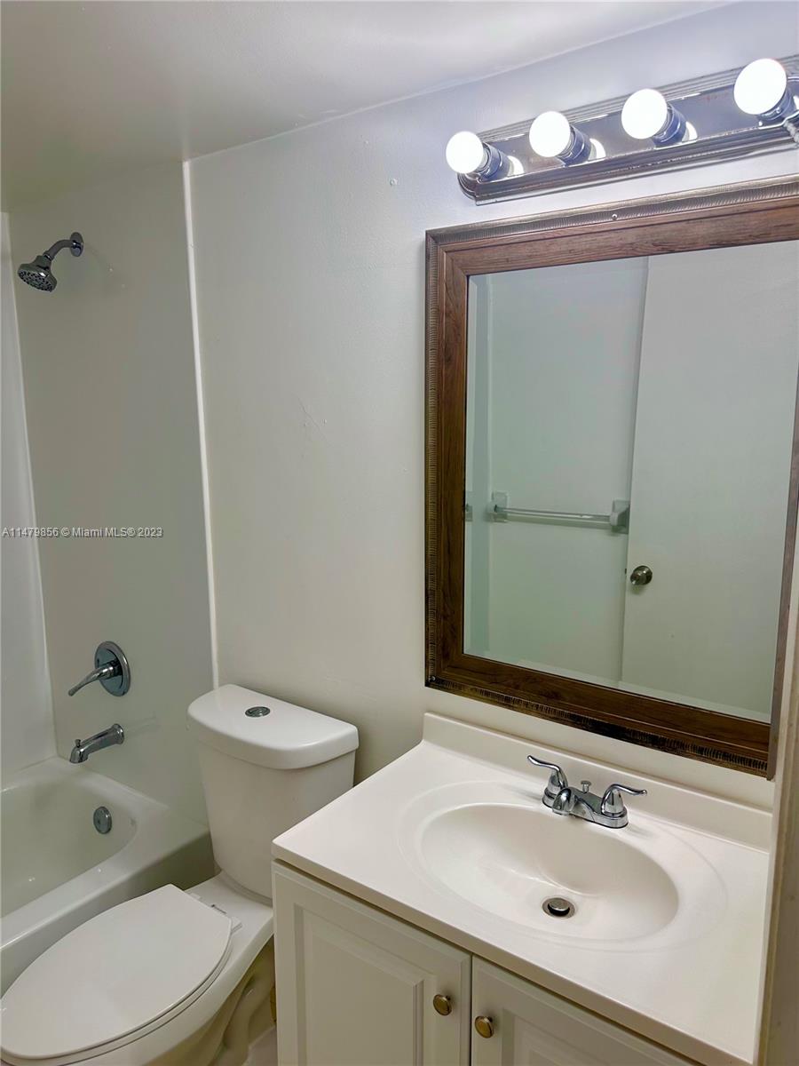 530 South Park Road, Unit 1711 Hollywood, FL 33021 - Photo 8 of 25 a bathroom with a sink a toilet and shower